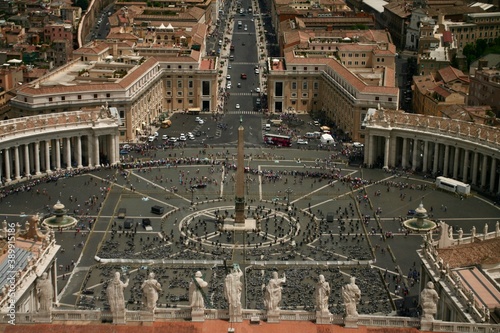 Beautiful piazza in Rome, Vatican City from top of the dome, lots of columns in rounded circular shape and famous statues infront of the town.