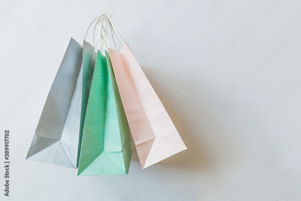 Simply minimal design three many shopping bag isolated on white background. Online or mall shopping shopaholic concept. Black friday Christmas season sale. Flat lay top view copy space, mock up Simply minimal design three many shopping bag isolated on white background. Online or mall shopping shopaholic concept. Black friday Christmas season sale. Flat lay top view copy space, mock up