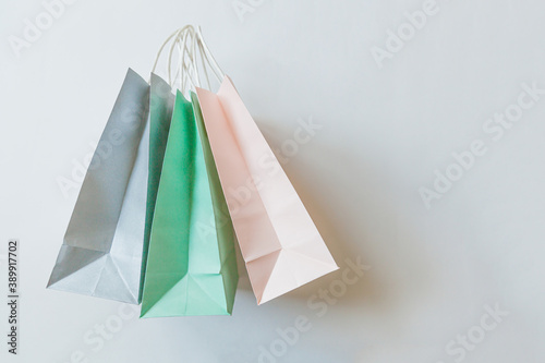 Simply minimal design three many shopping bag isolated on white background. Online or mall shopping shopaholic concept. Black friday Christmas season sale. Flat lay top view copy space, mock up