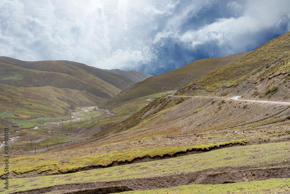 The view of destroyed tibetan road on highlands in mountains