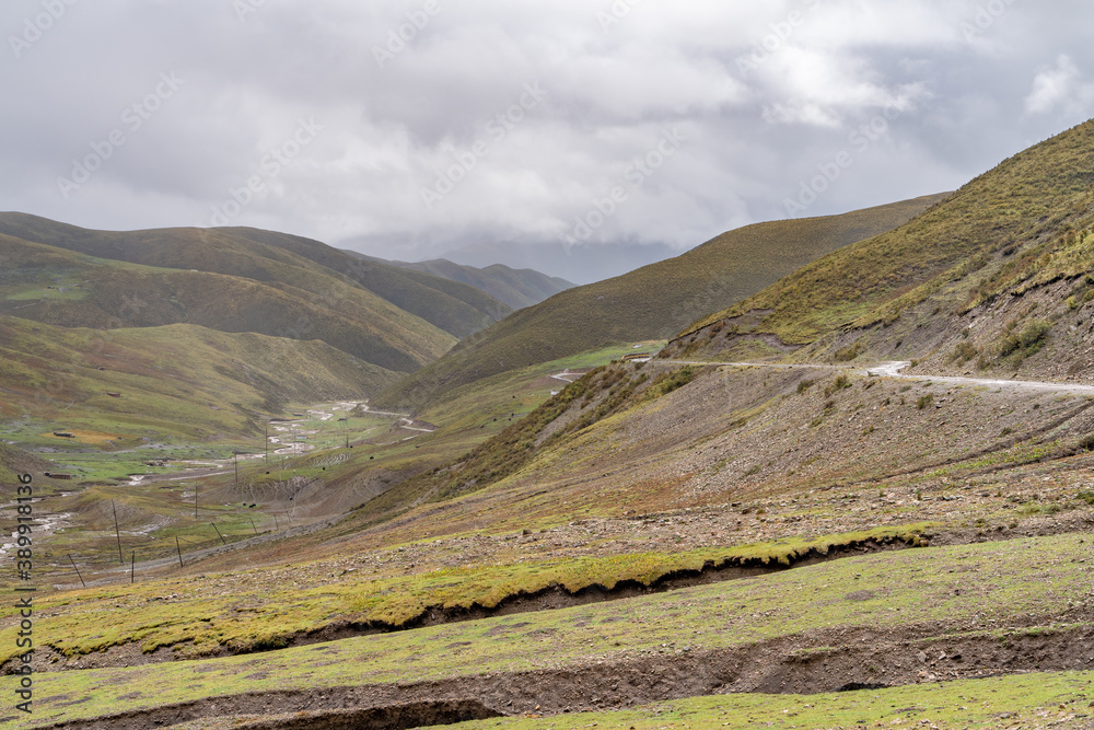 The view of destroyed tibetan road on highlands in mountains