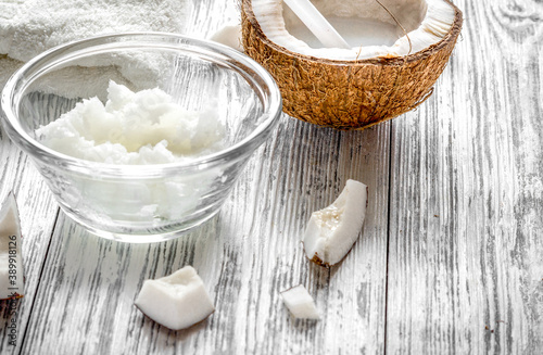 organic cosmetics with coconut on wooden background close up