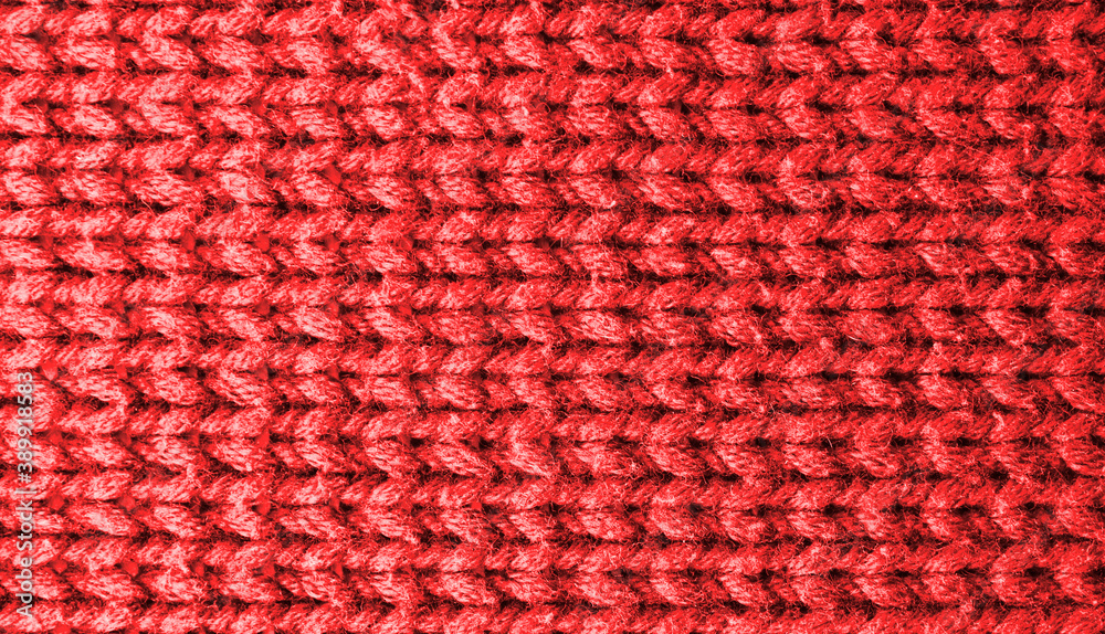 Knitted background. Red yarn texture. Horizontal knitting Knitted background. Red yarn texture. Horizontal knitting