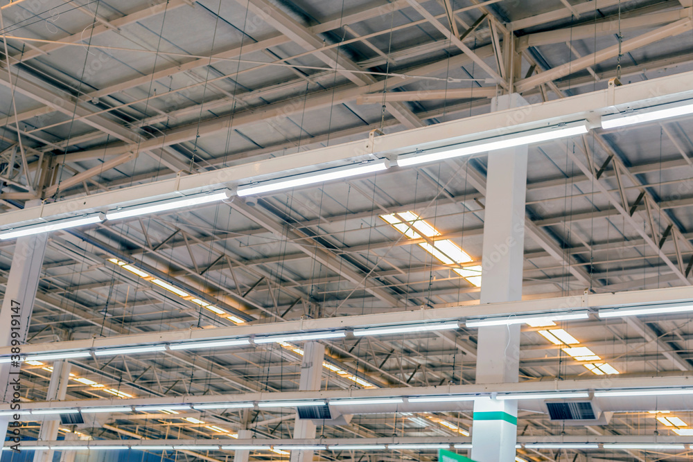 Steel roof structure. Light Bulb. Steel structure with roof tiles. Architectural structure of roof. Large roof layout used for industrial plants Steel roof structure. Light Bulb. Steel structure with roof tiles. Architectural structure of roof. Large roof layout used for industrial plants