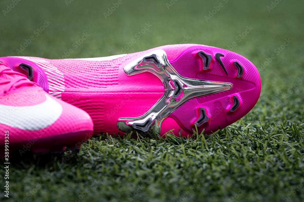 Bangkok / Thailand - September 2020 : Nike launch the new Mercurial Vapor  XIII football shoe as special edition for Kylian Mbappe in bright pink  berry colorway. Close-up and selective focus. Stock