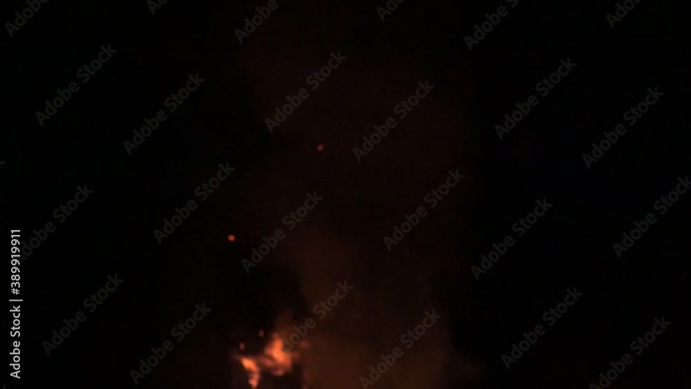 Flames and smoke late in the evening, slowing down the fire and smoke on a dark background.2020 Flames and smoke late in the evening, slowing down the fire and smoke on a dark background.2020