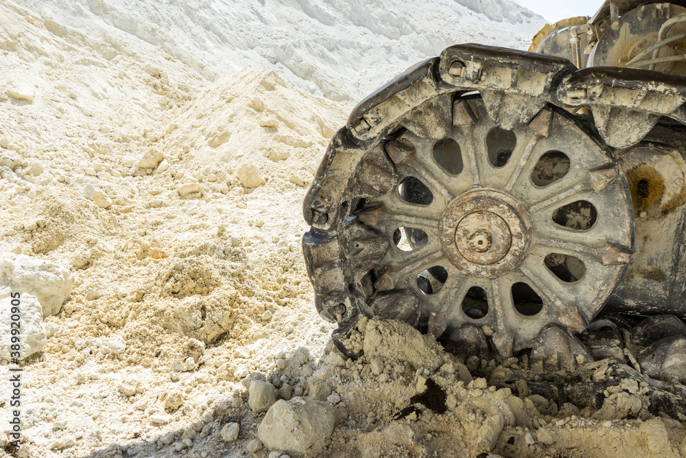 Rollers and track of a large self-propelled machine close up.