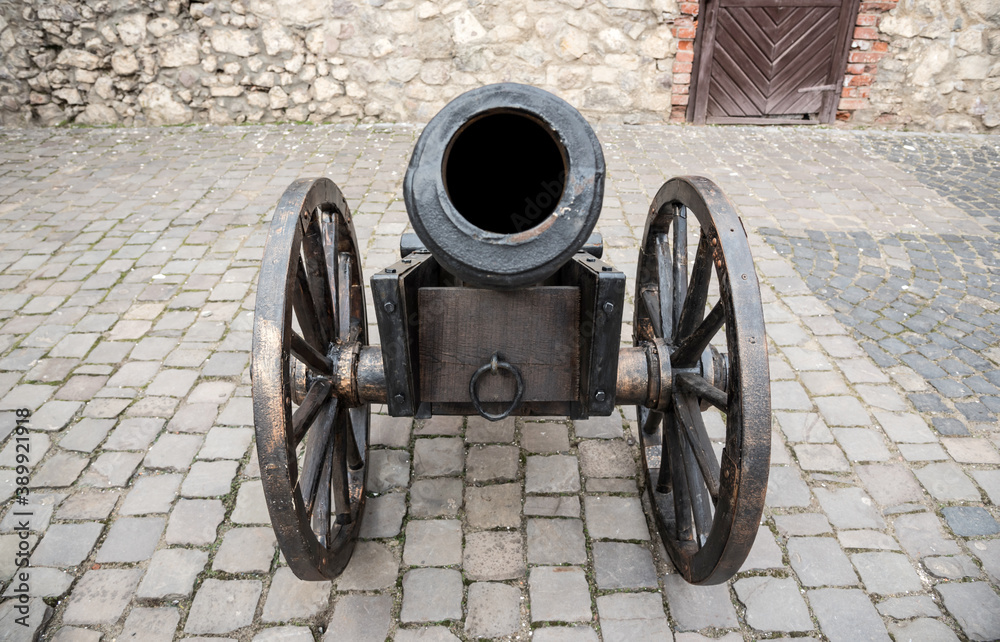 Old cannon. Antique iron cannon on wheels. Old cannon. Antique iron cannon on wheels.