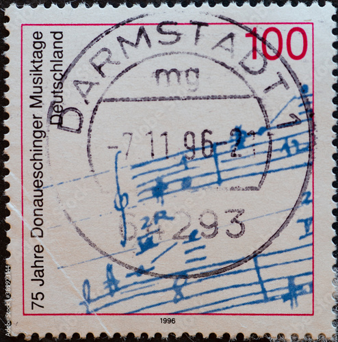 GERMANY - CIRCA 1996 : a postage stamp from Germany, showing a sheet of music on the occasion of the Donaueschinger Musiktage 75 years
