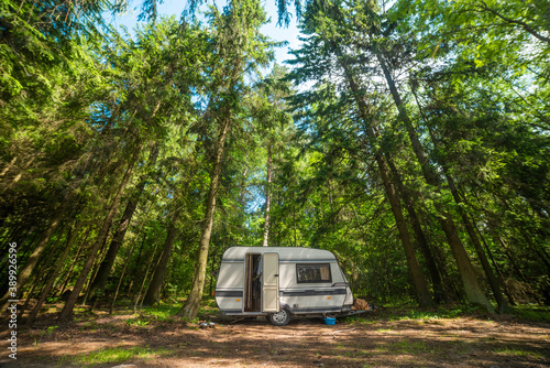 camper in the forest by the lake