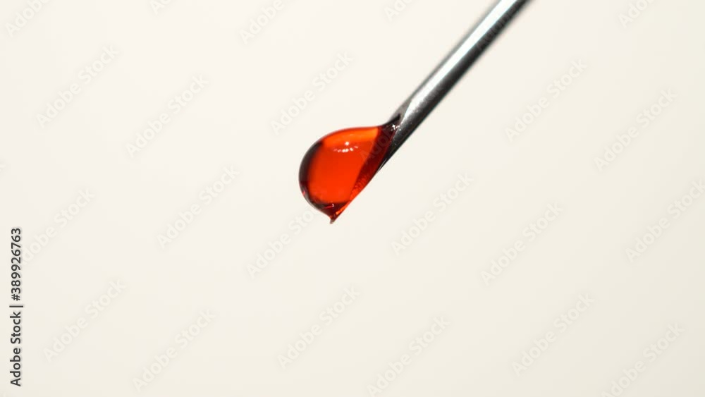 Drops of blood from the tip of the medical syringe. Bloody liquid dripping from needle, macro close up. Addiction horror illustration. Used syringe needle in blood. Administration of street drugs. Drops of blood from the tip of the medical syringe. Bloody liquid dripping from needle, macro close up. Addiction horror illustration. Used syringe needle in blood. Administration of street drugs.