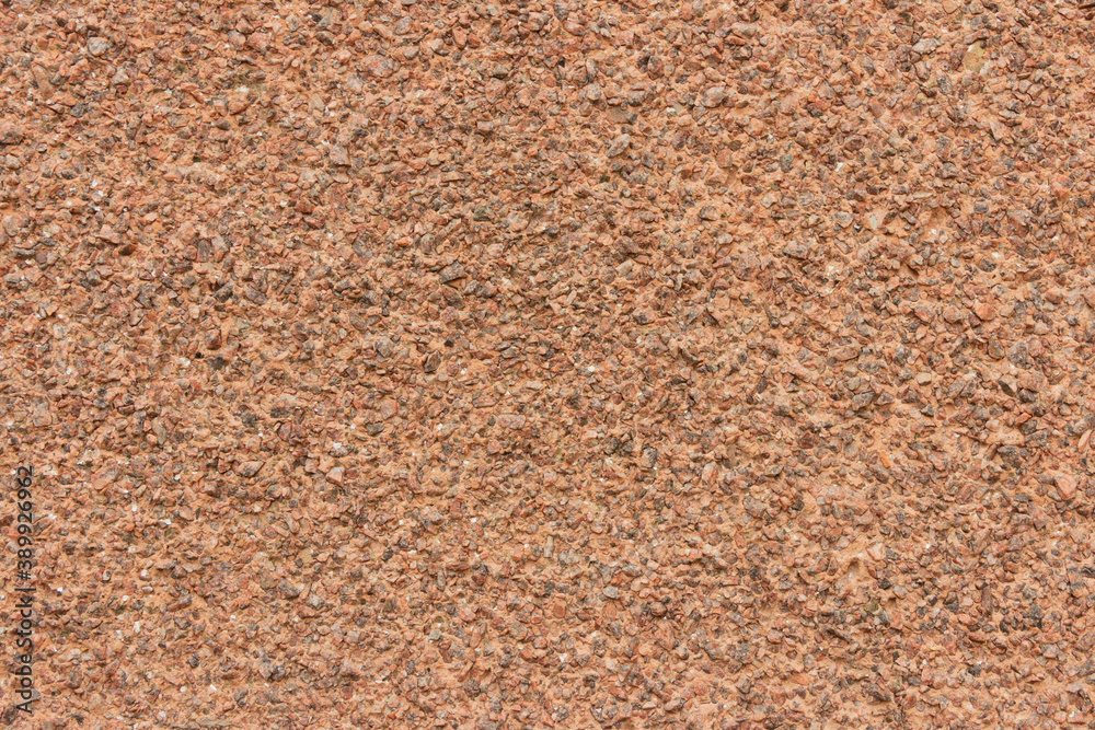 The surface of a rough uneven wall, plastered with fine marble chips. The surface of a rough uneven wall, plastered with fine marble chips.