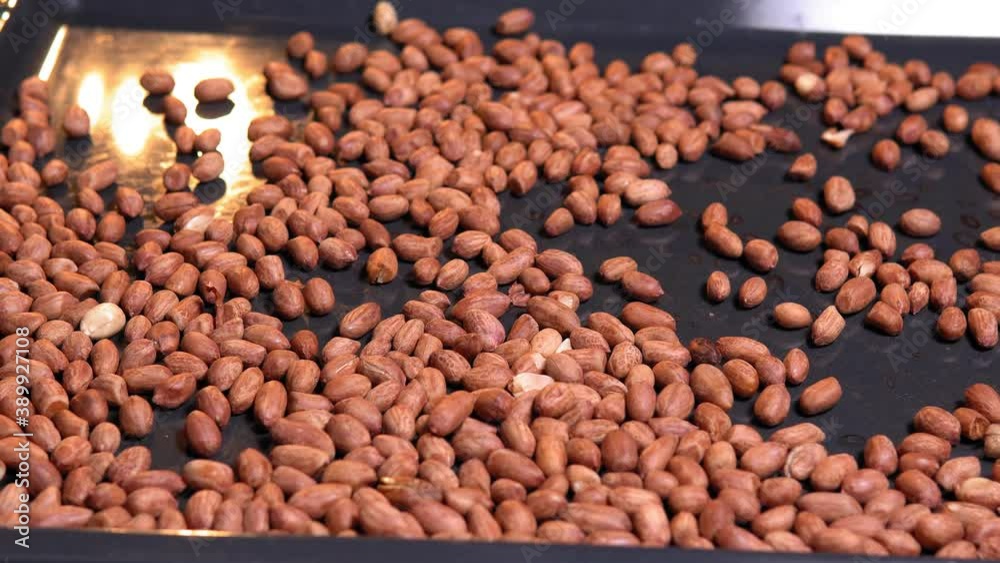 peanuts roasting in the oven close-up. Food preparation peanuts roasting in the oven close-up. Food preparation