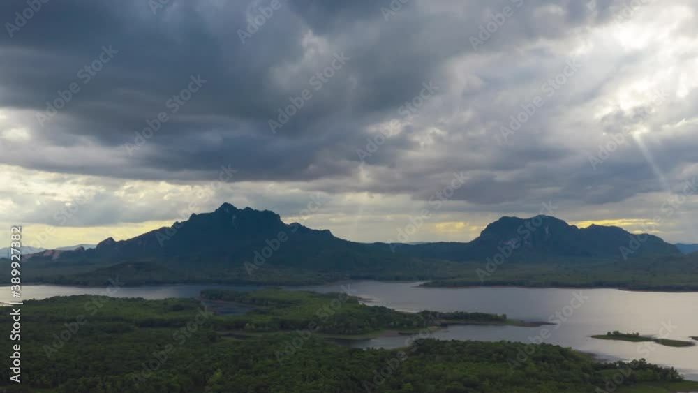 Hyper lapse 4K, Aerial view, evening view dramatic sky, sunset behind the mountains, colorfully, Mae Moh, Thailand. Hyper lapse 4K, Aerial view, evening view dramatic sky, sunset behind the mountains, colorfully, Mae Moh, Thailand.