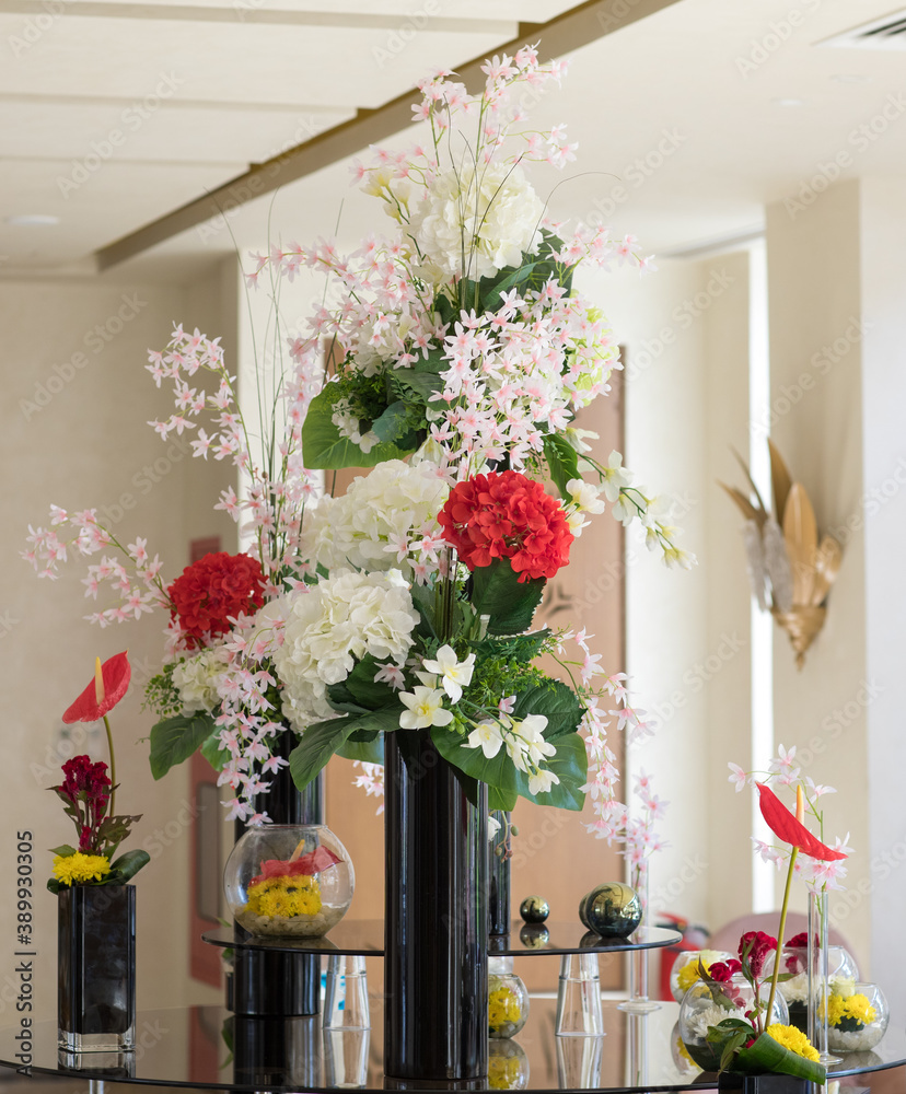 flowers in glass vase for hotel interior