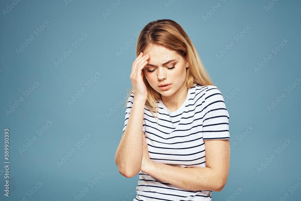 Emotional woman striped t-shirt lifestyle cropped blue background Emotional woman striped t-shirt lifestyle cropped blue background