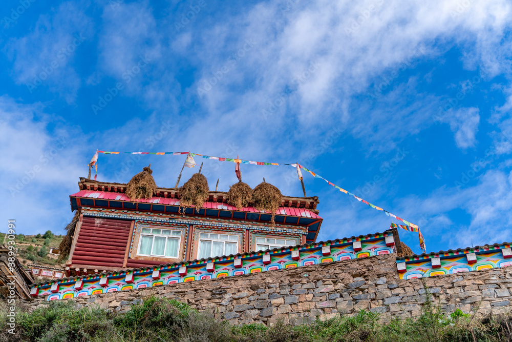Fototapeta premium The view of traditional old small tibetan remote village and family house on Tibet