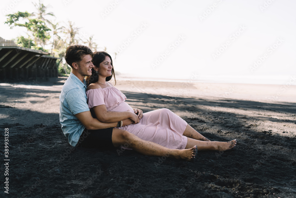 Loving couple resting on beach together Loving couple resting on beach together