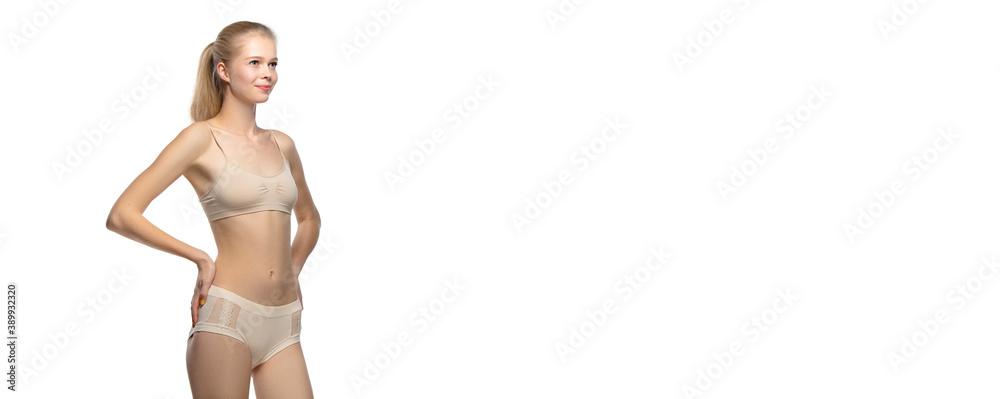 Horizontal flyer. Beautiful female model on white background. Beauty, cosmetics, spa, depilation, diet and treatment, fitness concept. Fit and sportive, sensual body with well-kept skin in underwear. Horizontal flyer. Beautiful female model on white background. Beauty, cosmetics, spa, depilation, diet and treatment, fitness concept. Fit and sportive, sensual body with well-kept skin in underwear.