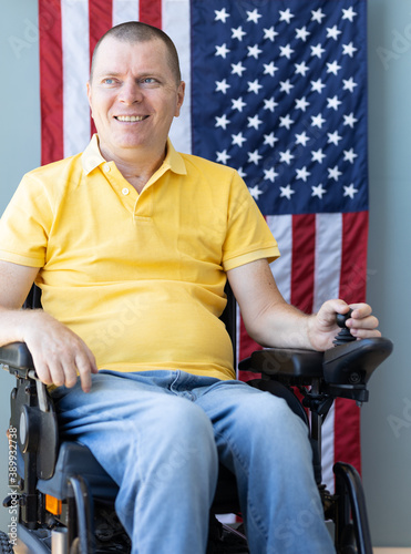 American freedom in wheelchair. USA flag