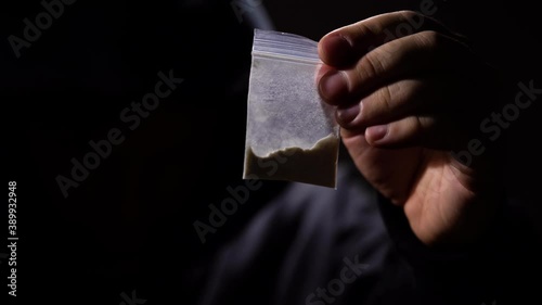 Drug trafficking concept. drug dealer selling dope in a nightclub. photo