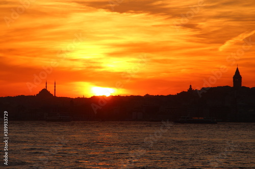 Cityscape of Istanbul at sunset with dramatic orange clouds. Sunset in Istanbul. Istanbul background photo.