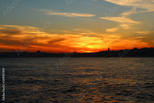 Cityscape of Istanbul at sunset with dramatic orange clouds. Sunset in Istanbul. Istanbul background photo.