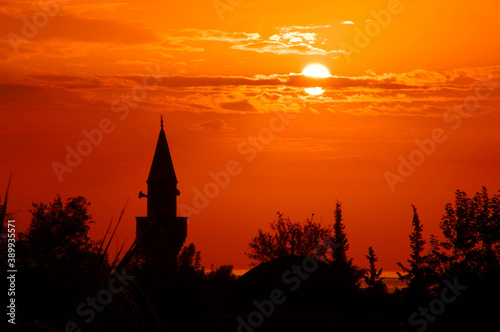 Mosque on the background of the sunset. © qwertfak