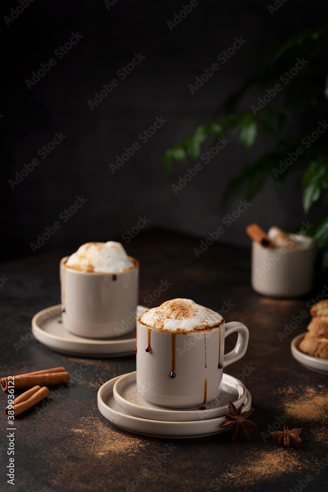 Hot winter cappuccino with cinnamon and caramel