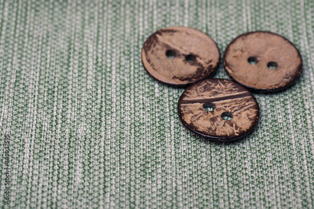 Three large old buttons made of wood on canvas from my grandmother's box. Vintage items for creativity and needlework. Three large old buttons made of wood on canvas from my grandmother's box. Vintage items for creativity and needlework.