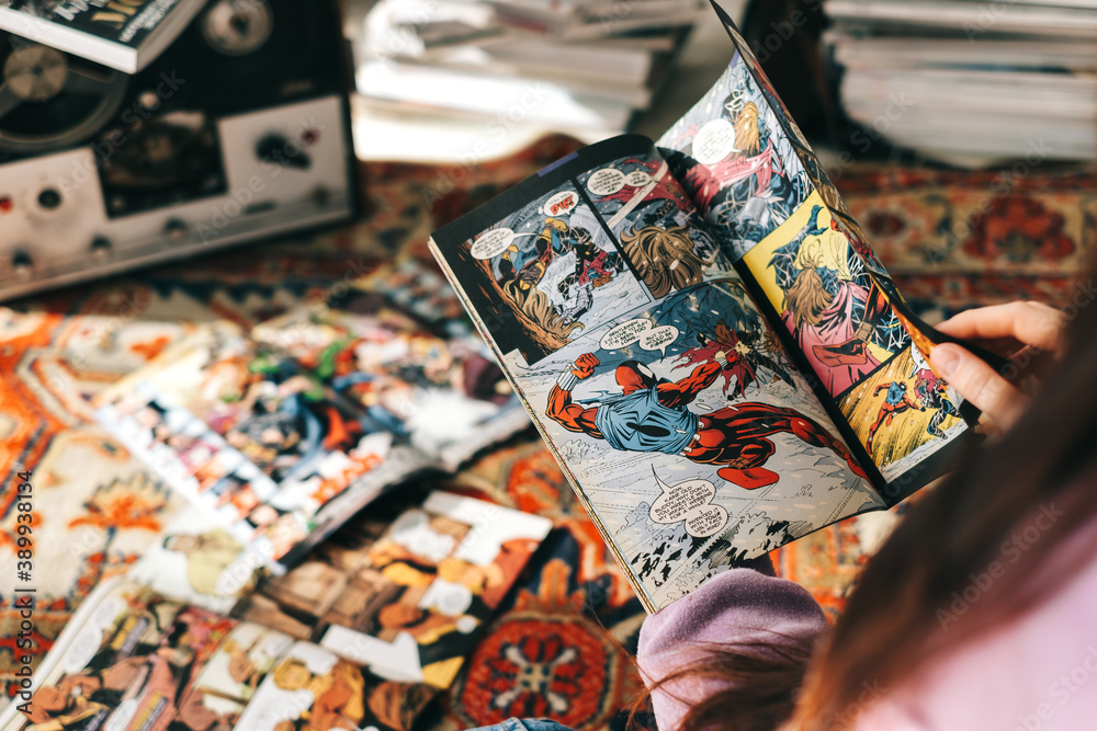 Obraz premium Person reading comic book at home. Rostov-on-Don, Russia. 20 October 2020