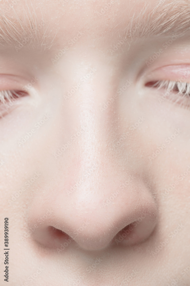 Nose and eyelid. Close up portrait of beautiful albino female model. Parts of face and body. Beauty, fashion, skincare, cosmetics, wellness concept. Copyspace. Well-kept skin, fresh look, details. Nose and eyelid. Close up portrait of beautiful albino female model. Parts of face and body. Beauty, fashion, skincare, cosmetics, wellness concept. Copyspace. Well-kept skin, fresh look, details.