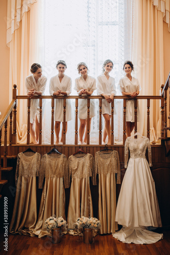 Wallpaper Mural Cheerful, young, attractive witnesses next to the bride. Wedding preparations. Fitting dresses. Torontodigital.ca