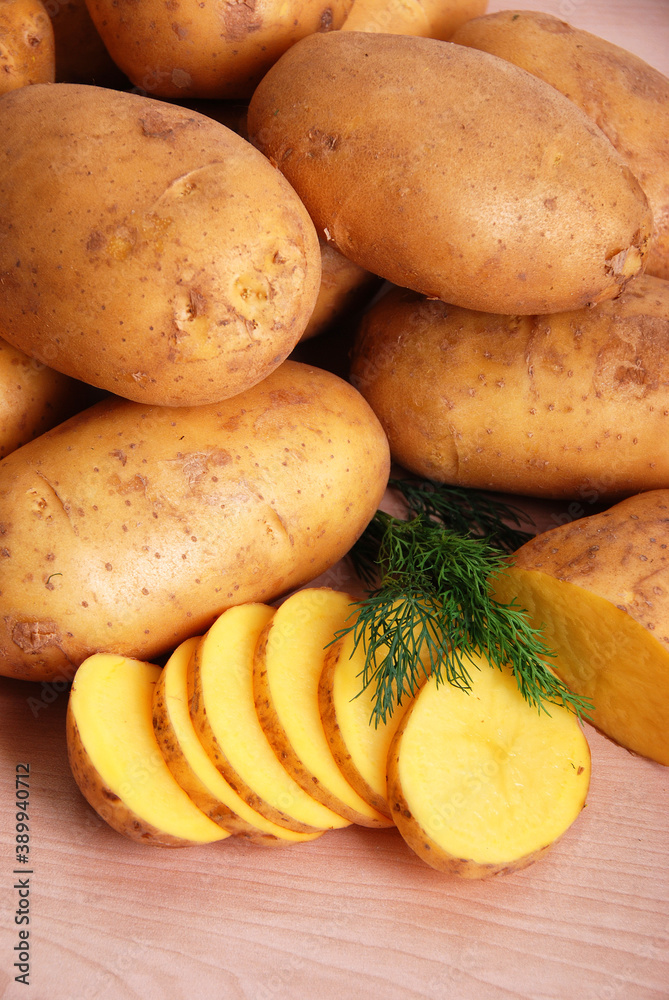 potatoes on wooden table potatoes on wooden table