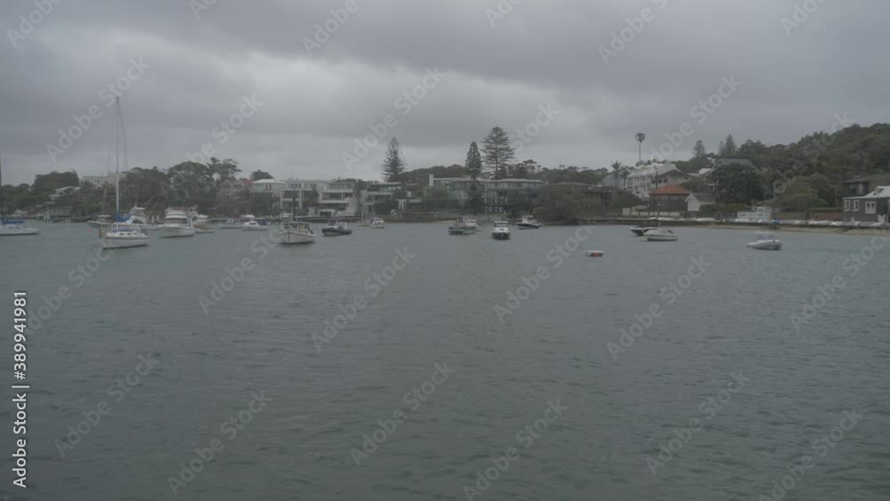Sailboats And Yachts Anchored In The Ocean On A Gloomy Day - Watsons Bay In Sydney, New South Wales, Australia. - wide shot Sailboats And Yachts Anchored In The Ocean On A Gloomy Day - Watsons Bay In Sydney, New South Wales, Australia. - wide shot