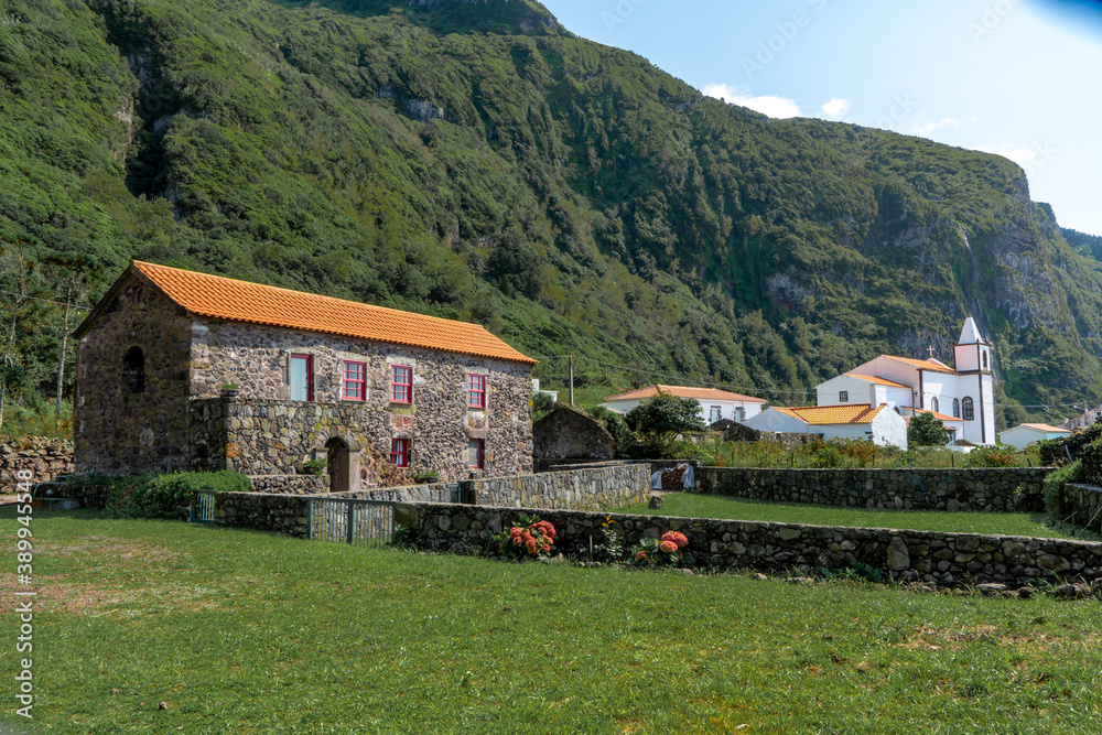 Azores, Island of Flores, view of the village of Ponta da Faja with traditional houses and church