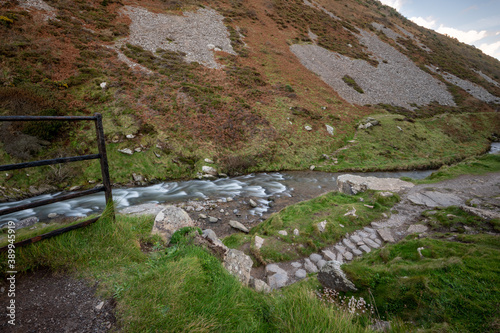 Long exposure of the river Heddon flowing through the Heddon valley at Heddons Mouth in Exmoor photo