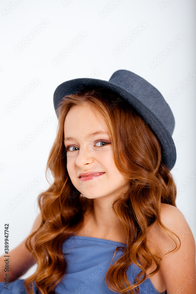 dressed in a light blue dress on spaghetti straps cute little girl on a white background dressed in a light blue dress on spaghetti straps cute little girl on a white background
