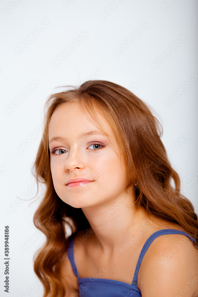 dressed in a light blue dress on spaghetti straps cute little girl on a white background dressed in a light blue dress on spaghetti straps cute little girl on a white background