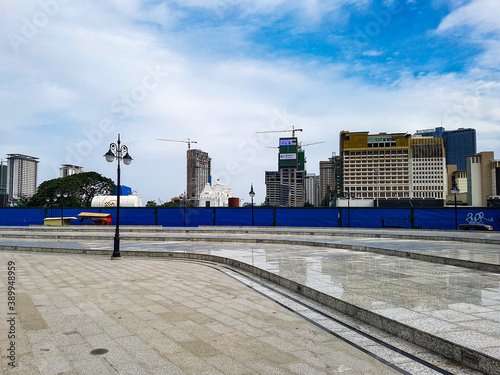 Cranes behind a construction site in the city ventre of phom penh cambodia photo