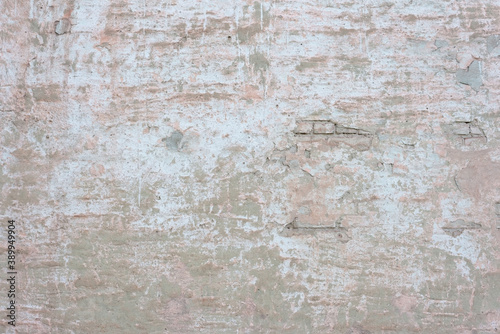 texture of old brick wall plaster on the wall of a street house