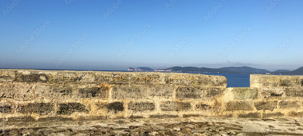 seafront bastion in alghero, sardinia, italy