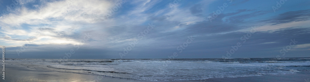 Sea, waves and beach. North sea coast. Julianadorp. Netherlands. Panorama.