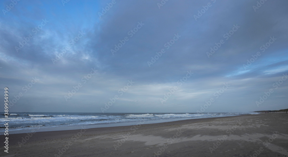 Sea, waves and beach. North sea coast. Julianadorp. Netherlands.