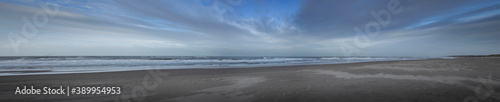 Sea, waves and beach. North sea coast. Julianadorp. Netherlands. Panorama.