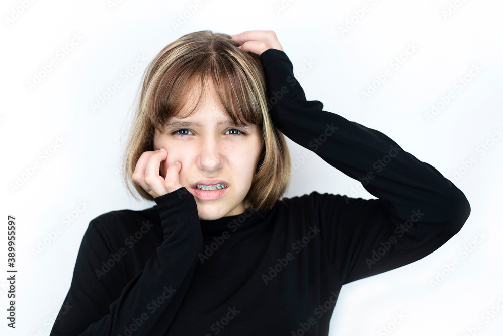 The young girl recently had braces on her teeth to straighten her teeth