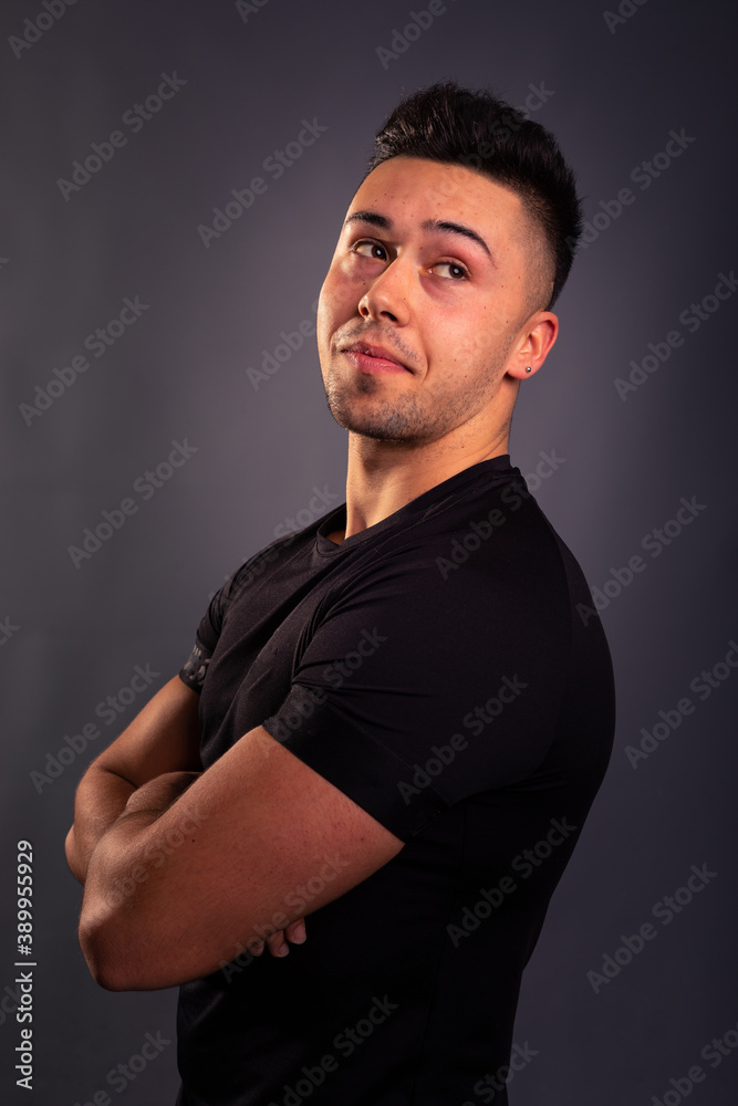 Handsome young man posing at the photo studio