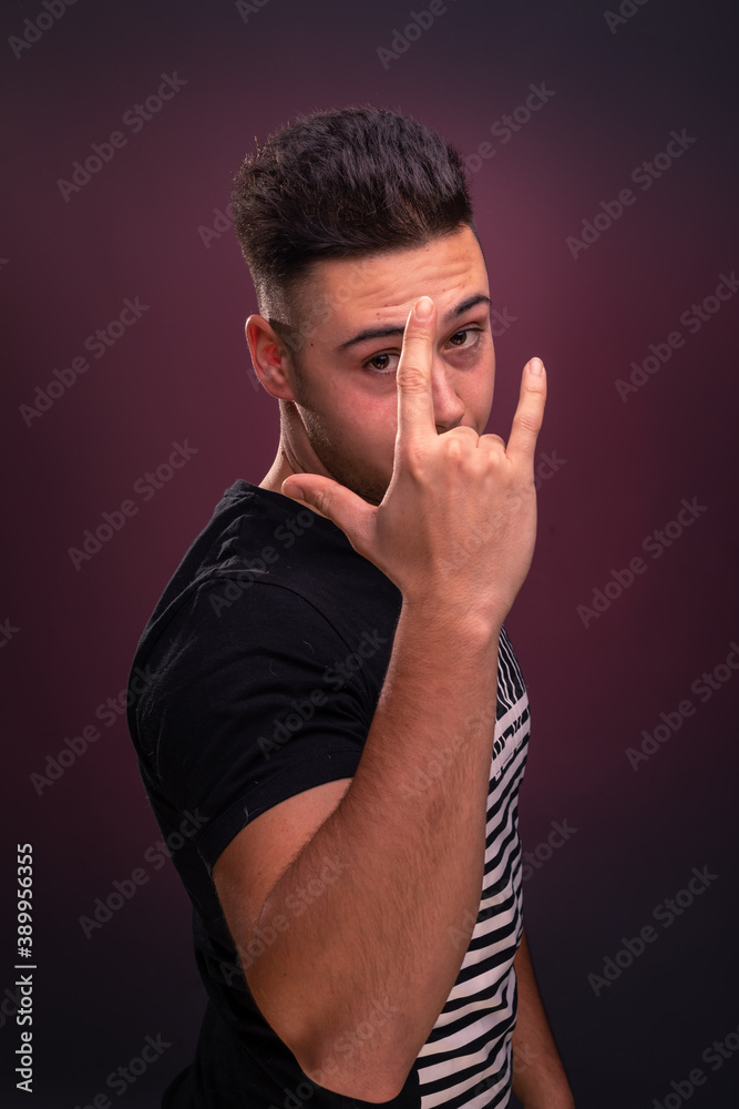 Handsome young man posing at the photo studio