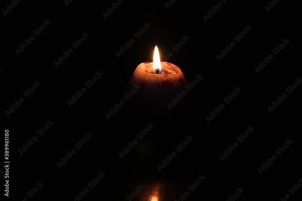 Lighted fire candle orange night dark shape Lighted fire candle orange night dark shape