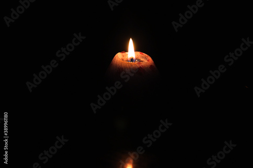 Lighted fire candle orange night dark shape